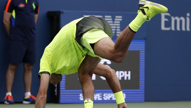 Juan Martin del Potro, of Argentina, loses his balance after a shot to David Ferrer, of Spain, during the third round of the U.S. Open tennis tournament, Saturday, Sept. 3, 2016, in New York. (AP Photo/Kathy Willens)