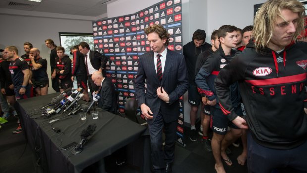 James Hird leaves the press conference after announcing his resignation from Essendon.