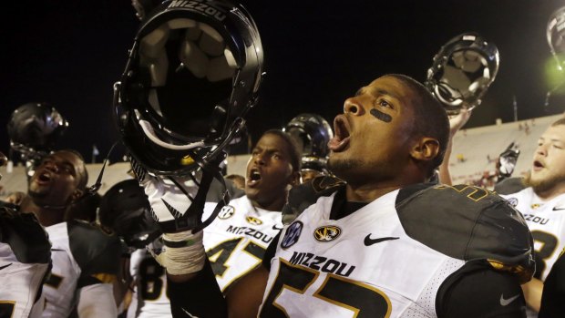 Missouri's Michael Sam sings the school song after Missouri defeated Indiana in an NCAA college football game in 2013.