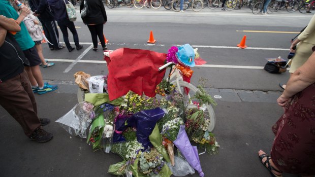 Flowers left on Sydney Road left in tribute to dooring victim Alberto Paulon.