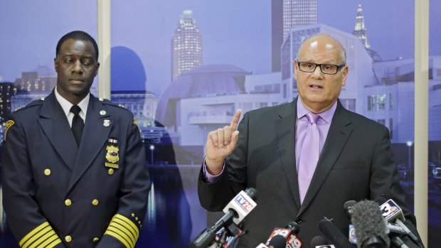 Cleveland police Deputy Chief Ed Tomba, right, and Chief Calvin Williams brief reporters on the investigation into the shooting by police of 12-year-old Tamir Rice last year.