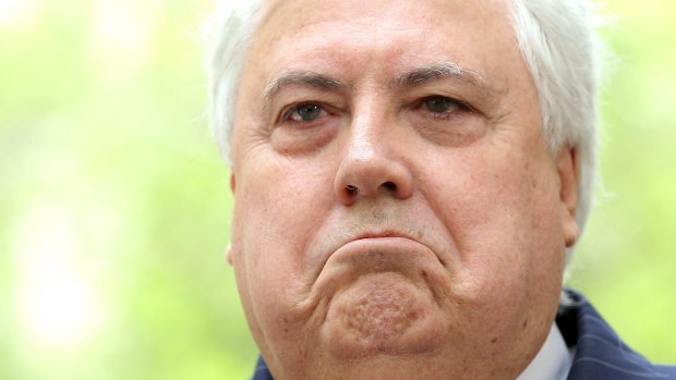 Clive Palmer has been comforting his daughter after the storm damage her home.