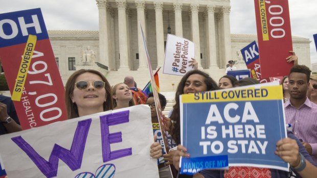 Supporters rally in front of the Supreme Court after the court's announcement.