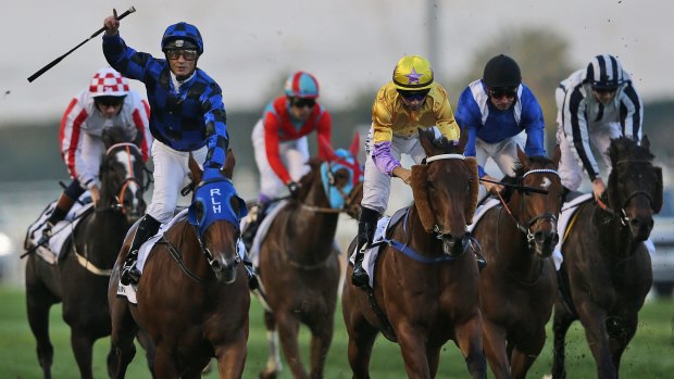 Victory salute: Buffering, ridden by Damian Browne, crosses the finish line to win the Al Quoz Sprint of the Dubai World Cup horse racing at the Meydan Racecourse in Dubai, United Arab Emirates.