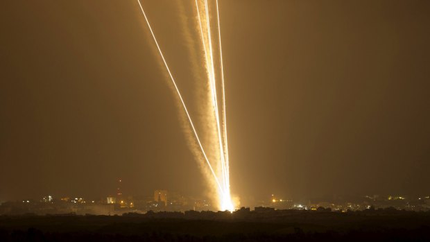 Light streaks and smoke trails from  rockets launched from Gaza towards Israel on July 23, 2014.