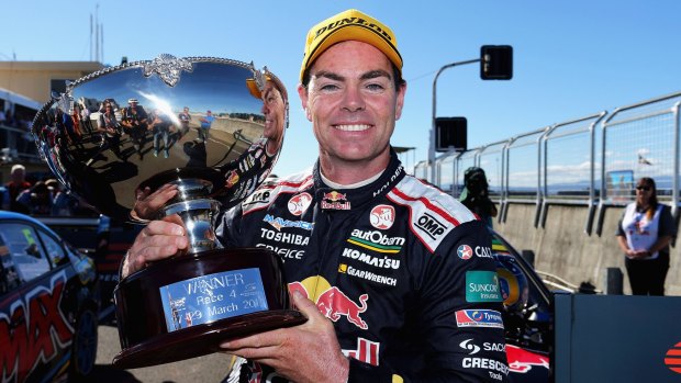 Poised to achieve a century of race wins: Craig Lowndes celebrates after winning race one.