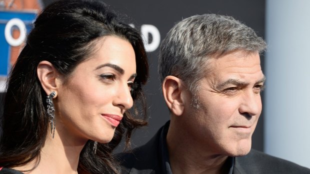 George Clooney, with wife Amal, has accused the magazine Hello! of running an interview that he never gave.