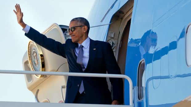 President Barack Obama boards Air Force One on the last day before Americans vote to replace him in the Oval Office.