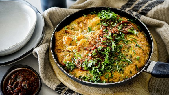 Potato gem-studded frittata with a stripe of  tomato salsa.