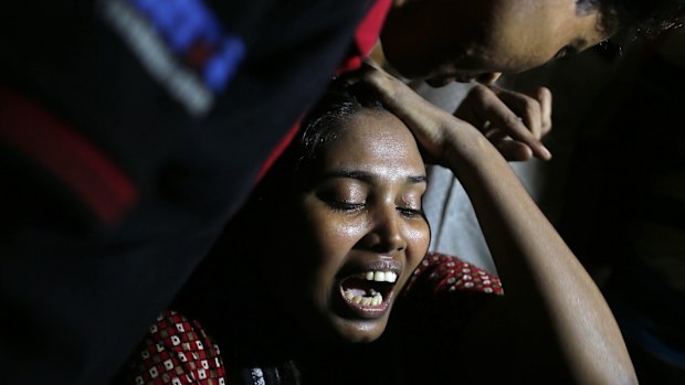 Ashamoni, widow of slain blogger Niloy Chatterjee, whose pen name was Niloy Neel, weeping at her house in Dhaka last year. 