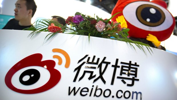 Staff members at a booth for Chinese microblogging website Sina Weibo at a conference in Beijing. Three popular Chinese internet services, including Sina Weibo, have been ordered to stop streaming video after censors complained they provided improper content