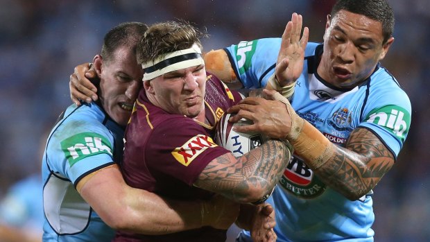 Hard man: Josh McGuire takes on Paul Gallen and Tyson Frizell during game two last season.