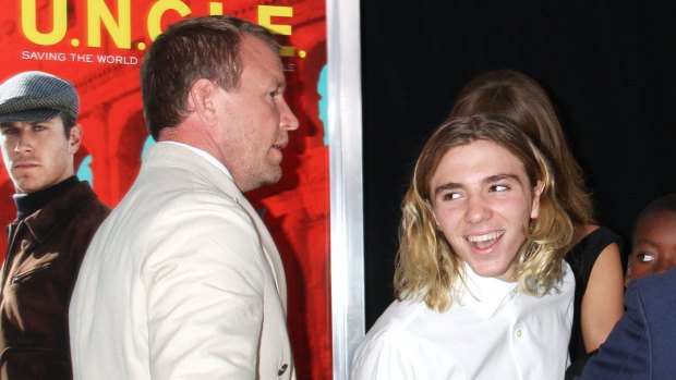 Guy Ritchie and Rocco Ritchie attend <i>The Man From U.N.C.L.E.</i> New York Premiere - Inside Arrivals at Ziegfeld Theater on August 10, 2015 in New York City.