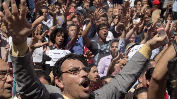 Egyptians shout slogans against Egyptian President Abdel-Fattah al-Sisi after the handover  of two Red Sea islands to Saudi Arabia.