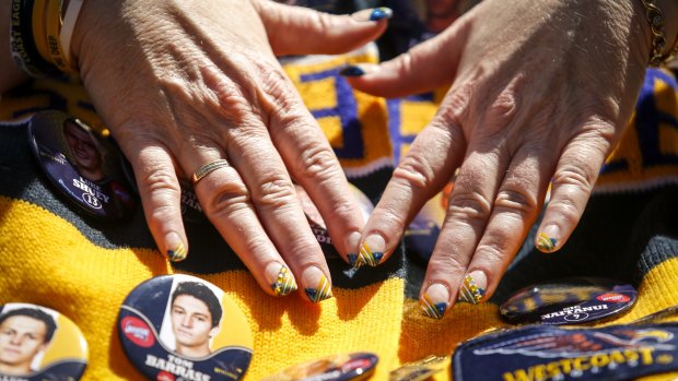 Footy fans were decked from head to finger tips in their team colours at the parade.