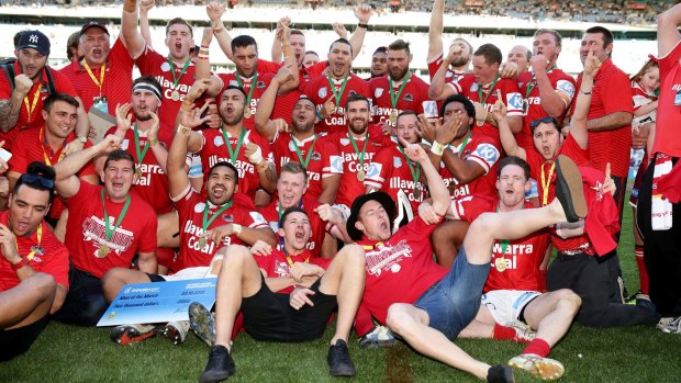Champions: The Cutters enjoy their moment after winning the 2016 Interstate Championship grand final.