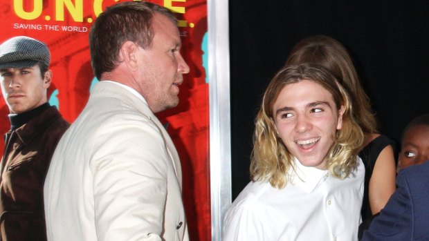 Guy Ritchie and Rocco Ritchie attend "The Man From U.N.C.L.E." New York Premiere - Inside Arrivals at Ziegfeld Theater on August 10, 2015 in New York City.