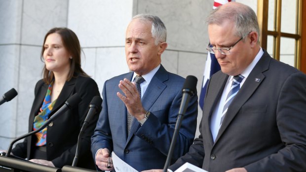 Prime Minister Malcolm Turnbull addresses the media during a joint press conference with Treasurer Scott Morrison (right) and Minister for Small Business and Assistant Treasurer Kelly O'Dwyer.