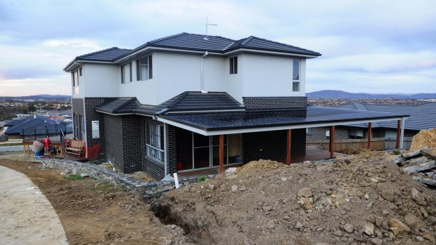 A home in Casey where the owners say they had to spend a substantial amount of money to dig out their block to comply with current solar rules.