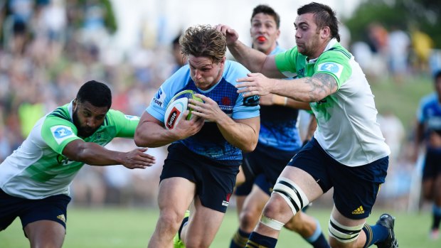 Thrills: NSW breakaway Michael Hooper breaks through the Highlanders defensive line.