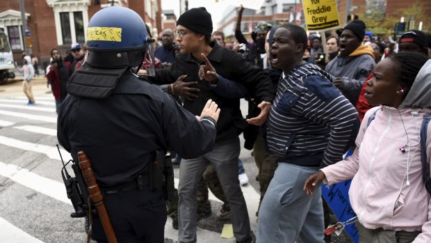 Demonstrators confront police near Camden Yards in Baltimore.