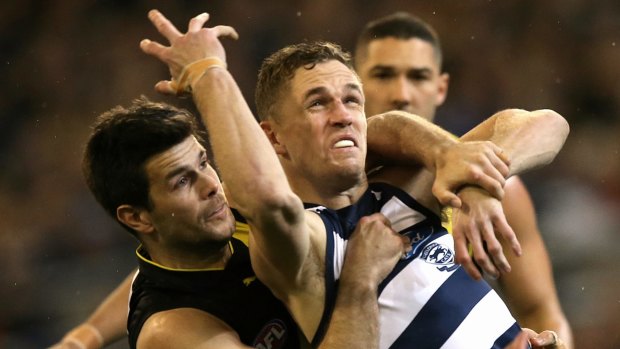 Joel Selwood tackled by Trent Cotchin before an around the neck free kick was paid to Selwood. 