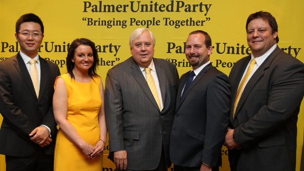 Clive Palmer with his MPs and ally Ricky Muir in 2013.