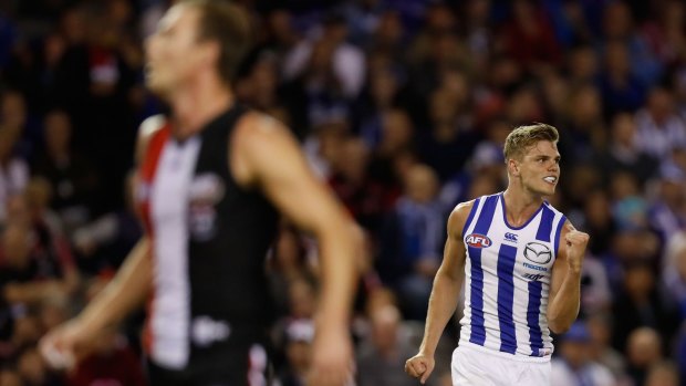 Mason Wood of the Kangaroos celebrates his goal and the win.