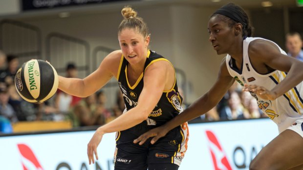 Evasive action: Boomer Bec Cole charges past Sydney import Asia Taylor.