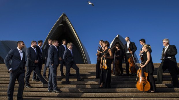 Players from the NSW Waratahs and members of the Sydney Symphony Orchestor on the steps of the Sydney Opera House.  
