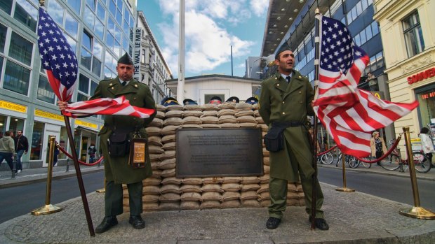 Soldiers at Checkpoint Charlie historical site in Berlin, Germany. 