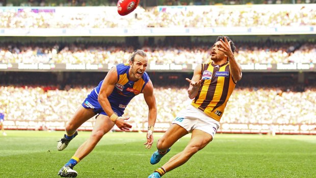 MELBOURNE, AUSTRALIA - OCTOBER 03:  Cyril Rioli of the Hawthorn Hawks marks the ball during the 2015 AFL Grand Final match between the West Coast Eagles and the Hawthorn Hawks at Melbourne Cricket Ground on October 3, 2015 in Melbourne, Australia.  (Photo by Scott Barbour/Fairfax Media)