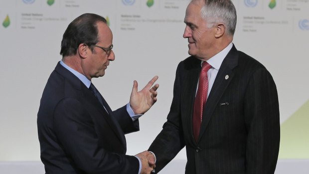 Francois Hollande greets Malcolm Turnbull as he arrives for the UN climate conference.