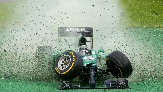 Caterham’s Kamui Kobayashi crashes at Albert Park. 