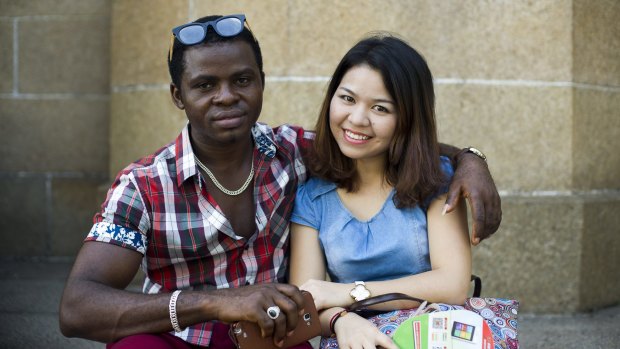 A Nigerian man and his Chinese girlfriend outside the Sacred Heart of Jesus Cathedral. 