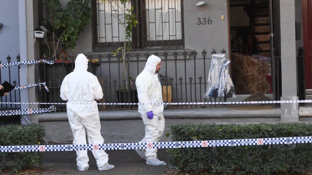Police officers at the scene of a raid in Surry Hills, Sydney.