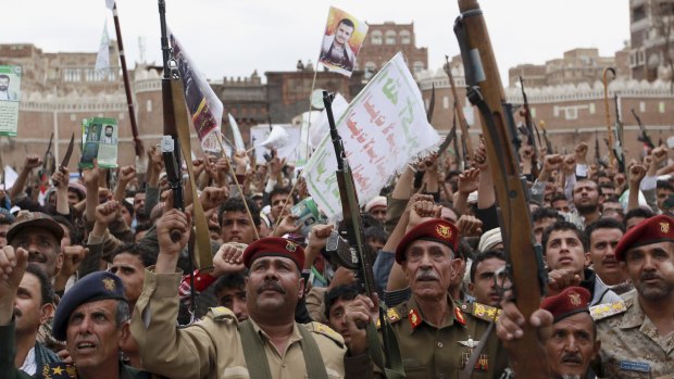 Houthi rebels protest against Saudi-led airstrikes, during a rally in Sanaa, Yemen.