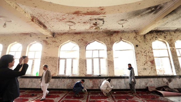 Suicide bombers struck two mosques in Afghanistan during Friday prayers, the Shiite mosque in Kabul and a Sunni mosque in western Ghor province at the end of a particularly deadly week for the troubled nation. 