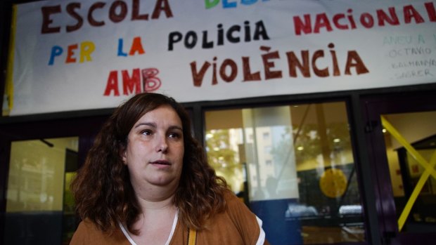 School teacher Elisa Aroca stands in front of the Estel School in central Barcelona, where National Police confiscated ballot boxes during the referendum voting. 
