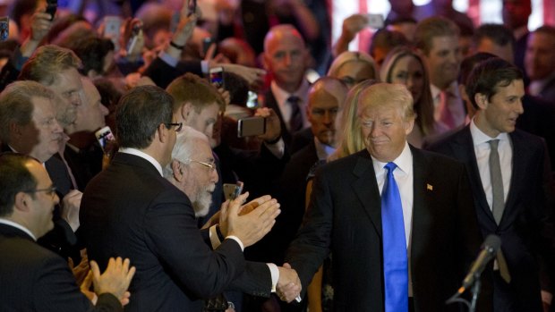 Donald Trump greets supporters in New York.