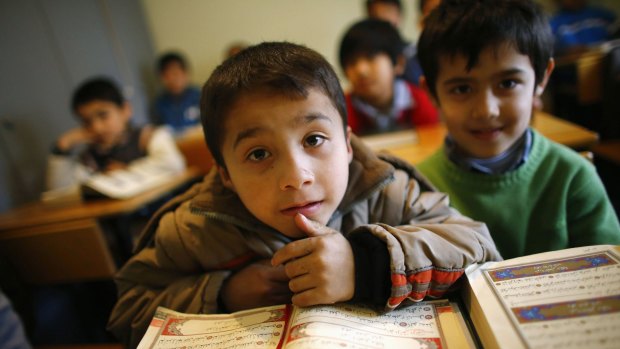 Uighur refugee boys read the Koran in Kayseri, Turkey, earlier this year. 