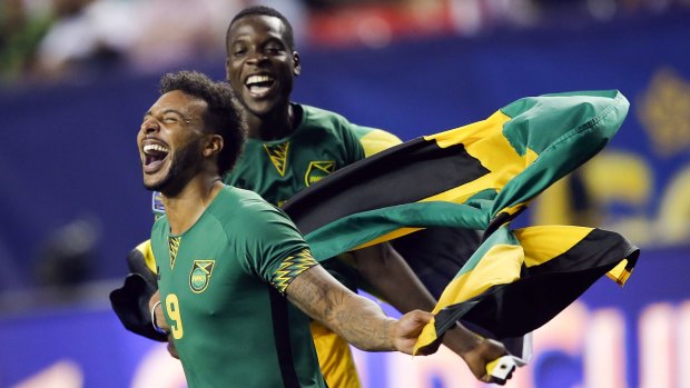 Jamaica's Giles Barnes and Je-Vaughn Watson celebrate.