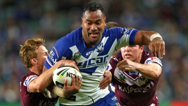 Unleashed: Tony Williams charges through the Manly defence.