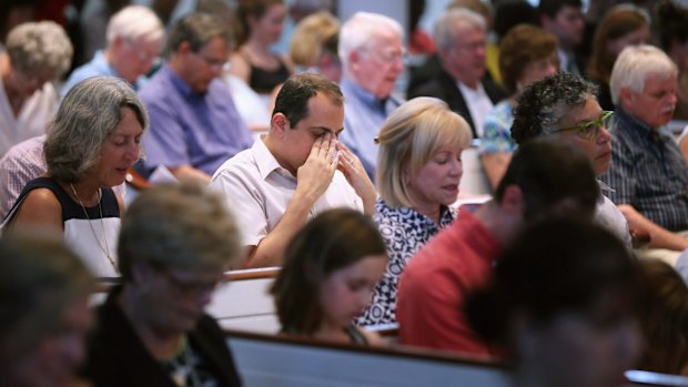 Mourners during a community prayer service for the nine victims.