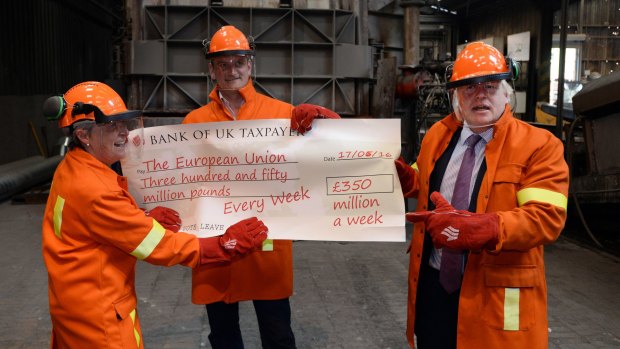 Boris Johnson and fellow MPs Gisela Stuart and Douglas Carswell throw a cheque into a furnace during an anti-EU photo stop in  Staffordshire, England, this week.