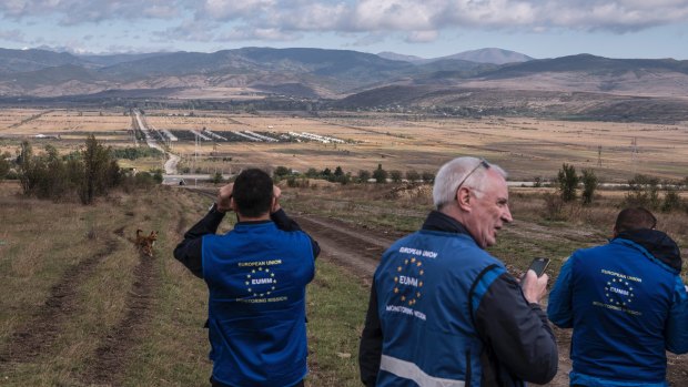 A European Union monitoring mission  checks spots on the "border" where South Ossetia has set up boundaries within Georgia, outside Gori, Georgia in September.