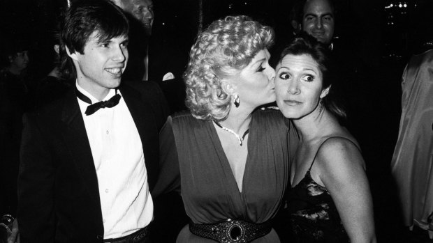 Debbie Reynolds with her children Todd and Carrie Fisher at the Thalians ball. 