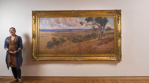 CMAG curator Deborah Clark with W Lister Lister's 'Federal Capital site', of 1913 Canberra.