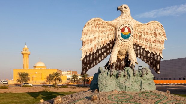 Falcon monument in a roundabout in the city of Madinat Zayed. Emirate of Abu Dhabi, United Arab Emirates.