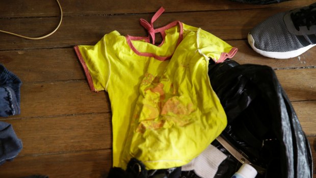 Children's clothing found on the floor of David Deakin's residence.